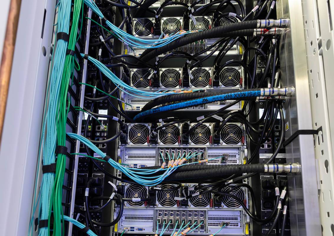 Liquid-cooled Supermicro servers inside xAI Colossus Rear